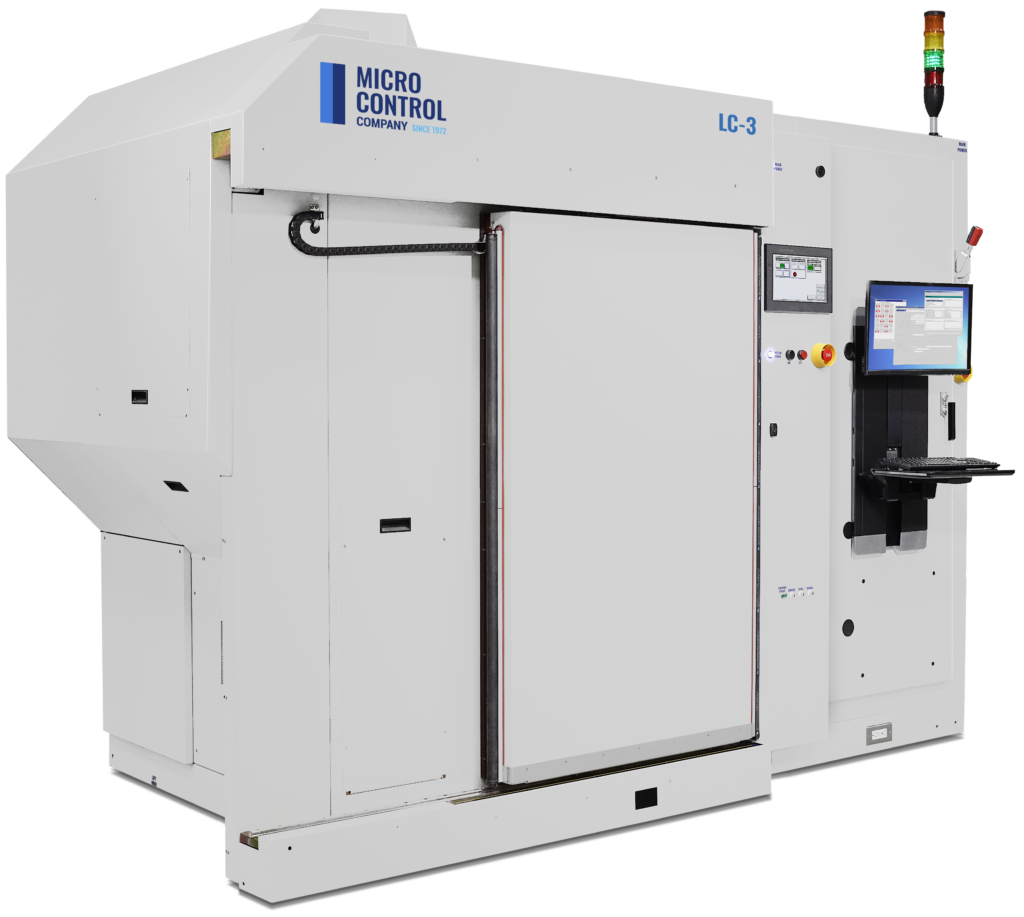 Micro Control Company LC-3 industrial testing machine with an integrated computer workstation.