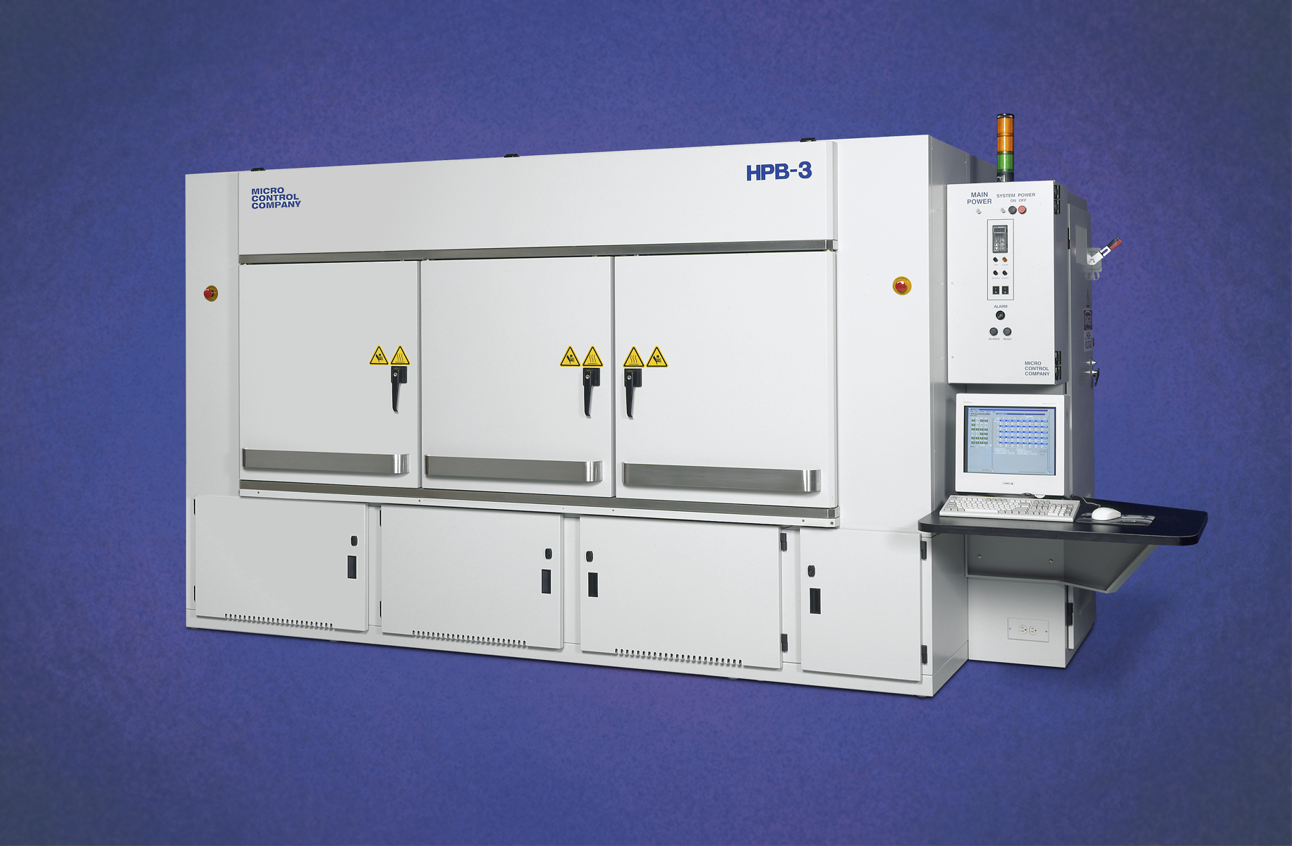Micro Control Company HPB-3 industrial test chamber with a control panel, monitor, and keyboard on a side console.